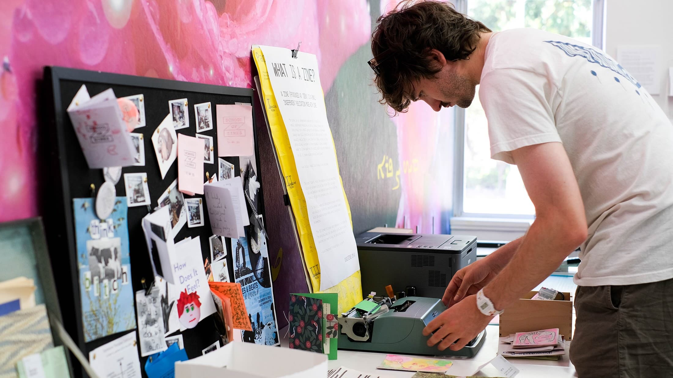 Participant experimenting with a typewriter at a School of Zines workshop